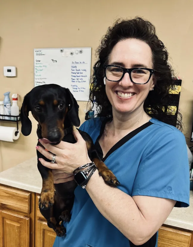 Spay Oklahoma veterinary staff member caring for a dog